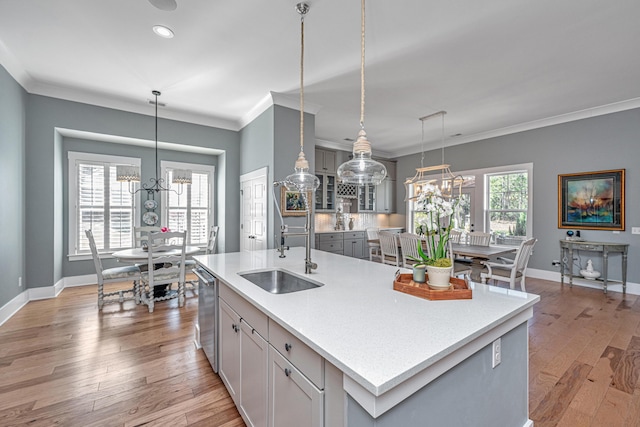 225 Camber Rd, Huger, SC 29450 - kitchen with a sink, stainless steel dishwasher, ornamental molding, baseboards, and an island with sink