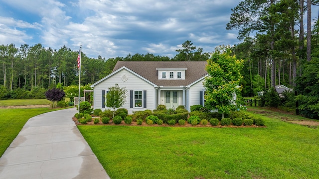 225 Camber Rd, Huger, SC 29450 - view of front of house featuring a front lawn, french doors, concrete driveway, and a shingled roof
