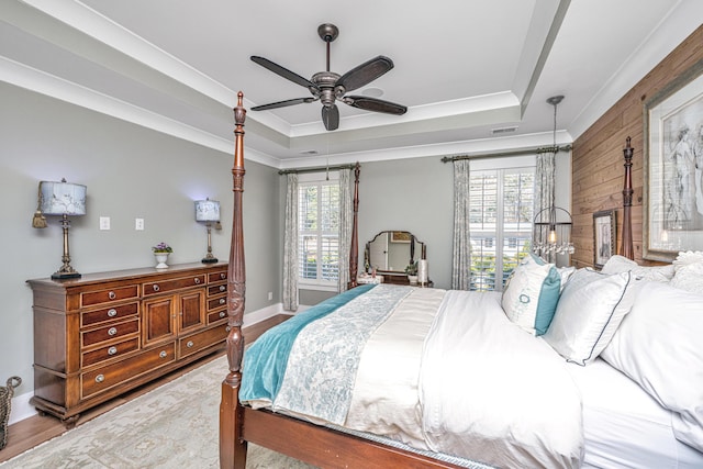 225 Camber Rd, Huger, SC 29450 - bedroom featuring wooden walls, a tray ceiling, wood finished floors, ornamental molding, and baseboards
