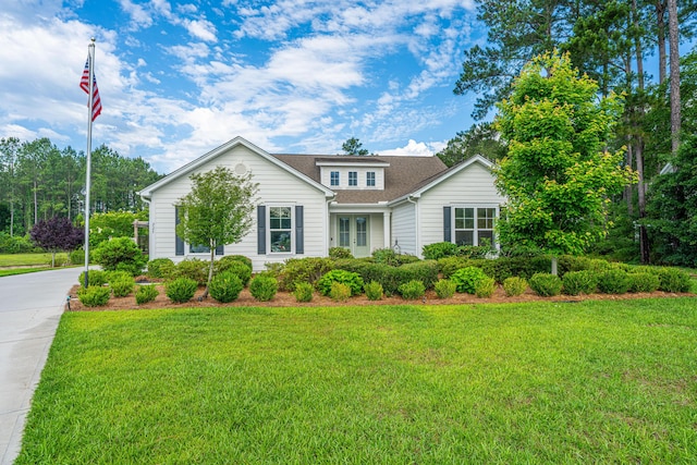 225 Camber Rd, Huger, SC 29450 - view of front of home with a front lawn, a shingled roof, and driveway