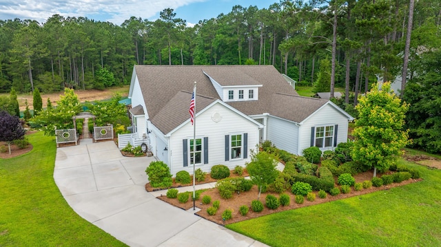 225 Camber Rd, Huger, SC 29450 - view of front of home featuring concrete driveway, a front lawn, and roof with shingles
