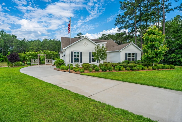 225 Camber Rd, Huger, SC 29450 - traditional-style home with driveway, a front lawn, and a shingled roof