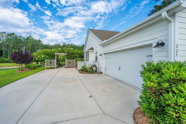 225 Camber Rd, Huger, SC 29450 - view of side of home with driveway and a garage