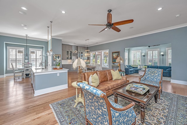 225 Camber Rd, Huger, SC 29450 - living area with crown molding, a ceiling fan, recessed lighting, baseboards, and a chandelier