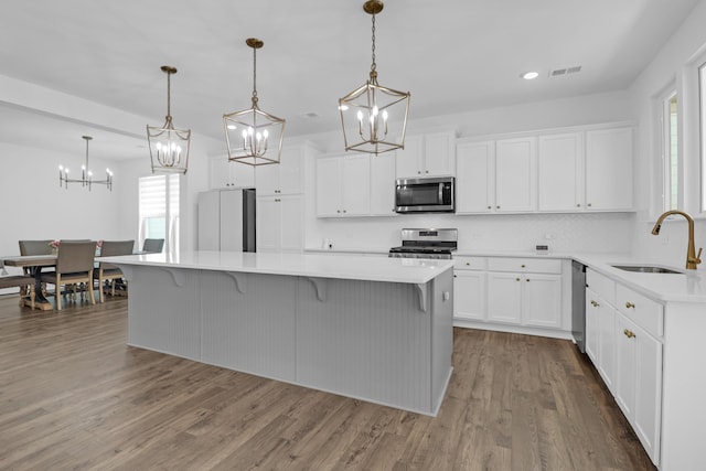 1238 Homecoming Blvd, Ravenel, SC 29470 - kitchen with an inviting chandelier, stainless steel appliances, visible vents, and a sink