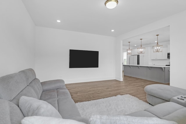 1238 Homecoming Blvd, Ravenel, SC 29470 - living area featuring baseboards, a chandelier, recessed lighting, and wood finished floors