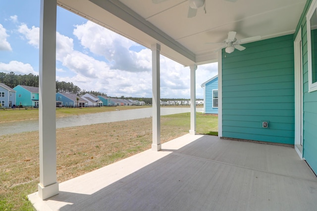 1238 Homecoming Blvd, Ravenel, SC 29470 - view of patio with a water view, a residential view, and a ceiling fan