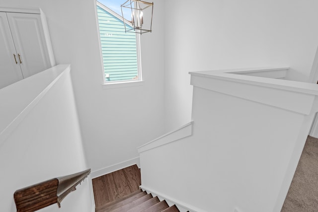 1238 Homecoming Blvd, Ravenel, SC 29470 - staircase featuring wood finished floors, a chandelier, and baseboards