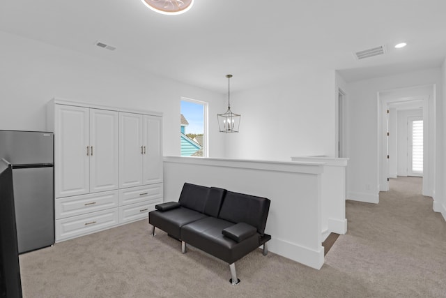 1238 Homecoming Blvd, Ravenel, SC 29470 - living area with light colored carpet, visible vents, an upstairs landing, and a chandelier