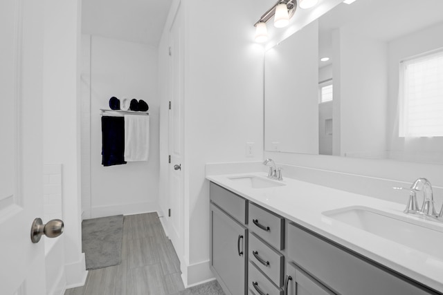 1238 Homecoming Blvd, Ravenel, SC 29470 - full bathroom featuring a sink, double vanity, and baseboards