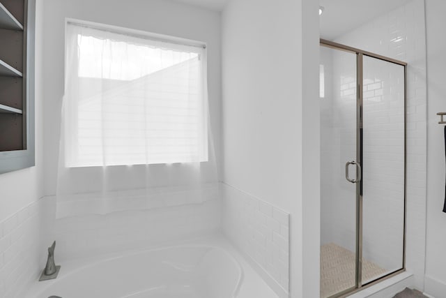 1238 Homecoming Blvd, Ravenel, SC 29470 - bathroom featuring a bath, a wealth of natural light, and a stall shower