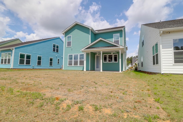 1238 Homecoming Blvd, Ravenel, SC 29470 - rear view of property featuring a ceiling fan and a lawn