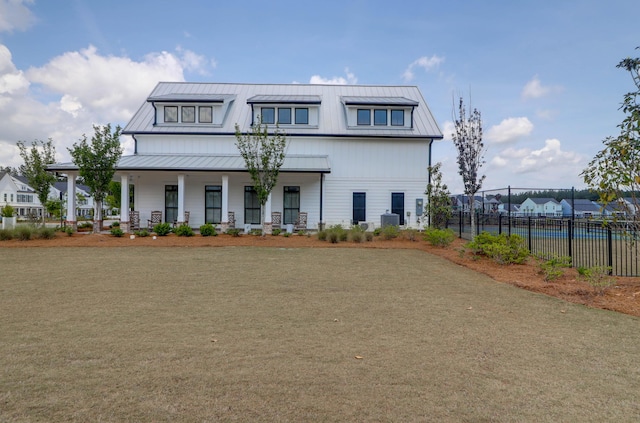 1238 Homecoming Blvd, Ravenel, SC 29470 - modern farmhouse with a porch, fence, metal roof, and a standing seam roof