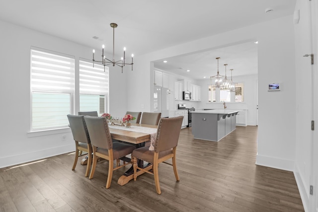 1238 Homecoming Blvd, Ravenel, SC 29470 - dining space with a wealth of natural light, a notable chandelier, and dark wood-style floors