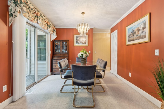 carpeted dining space with crown molding, a textured ceiling, and a chandelier