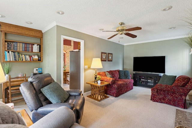 carpeted living room with crown molding, ceiling fan, and a textured ceiling