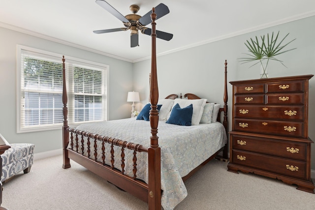 carpeted bedroom featuring crown molding and ceiling fan