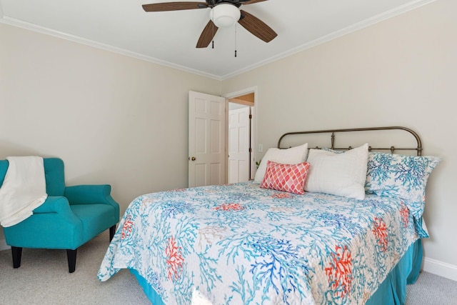 bedroom featuring ornamental molding, carpet floors, and ceiling fan