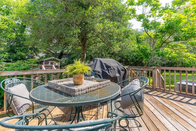 wooden deck featuring area for grilling