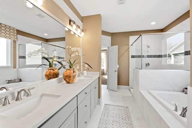 bathroom with dual vanity, tile patterned flooring, and separate shower and tub