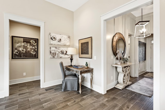 office space featuring dark hardwood / wood-style flooring and an inviting chandelier