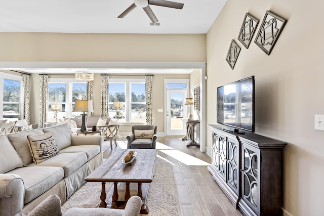 living room featuring hardwood / wood-style flooring and ceiling fan