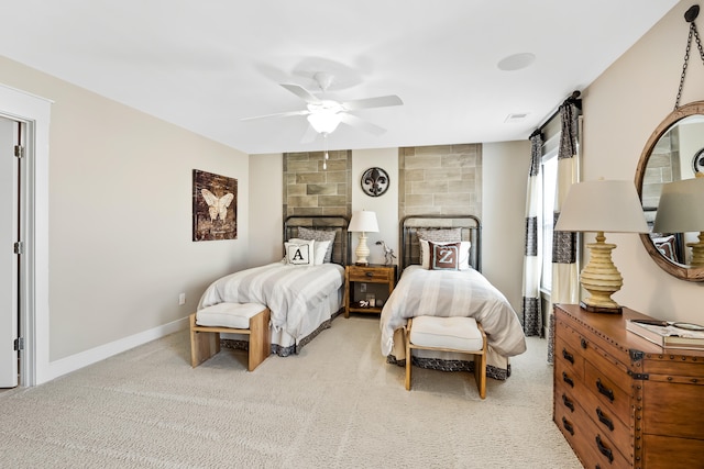 bedroom featuring tile walls, carpet floors, and ceiling fan