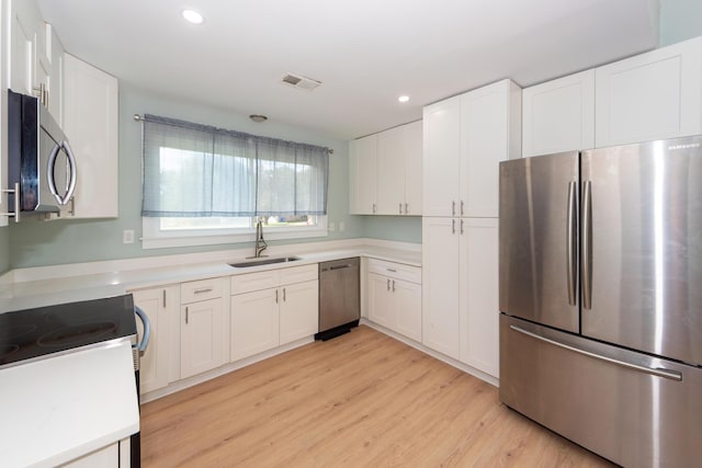 4836 Hillock Ave, North Charleston, SC 29418 - kitchen with stainless steel appliances, recessed lighting, light wood finished floors, white cabinetry, and light countertops
