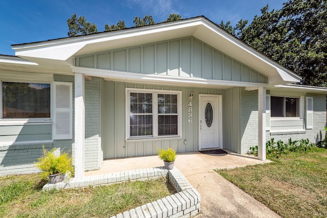 4836 Hillock Ave, North Charleston, SC 29418 - view of front facade featuring brick siding, board and batten siding, and a porch