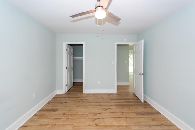 4836 Hillock Ave, North Charleston, SC 29418 - unfurnished bedroom with light wood-type flooring, a walk in closet, a ceiling fan, and a closet