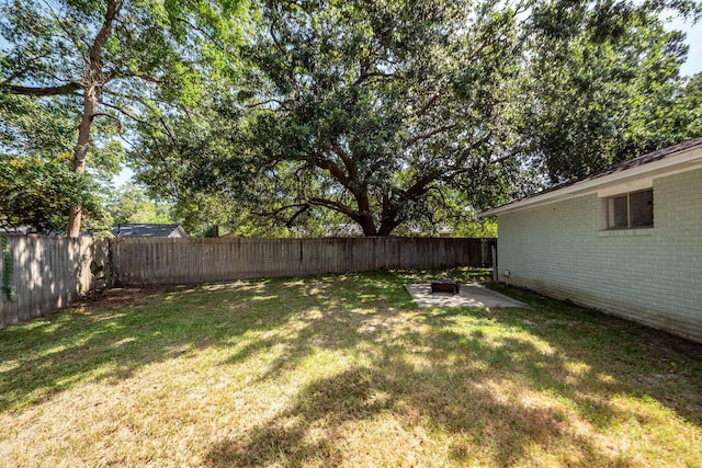 4836 Hillock Ave, North Charleston, SC 29418 - fenced backyard featuring a patio and a fire pit