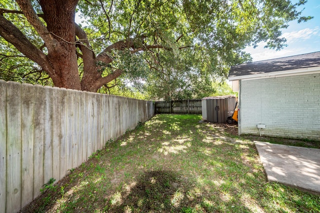 4836 Hillock Ave, North Charleston, SC 29418 - fenced backyard featuring a storage unit