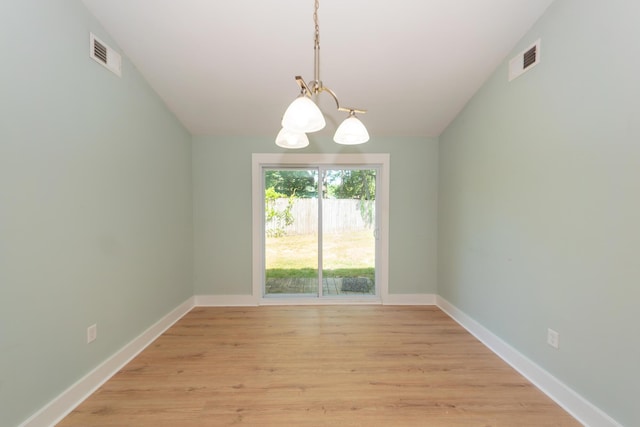 4836 Hillock Ave, North Charleston, SC 29418 - spare room featuring a chandelier and light wood-type flooring