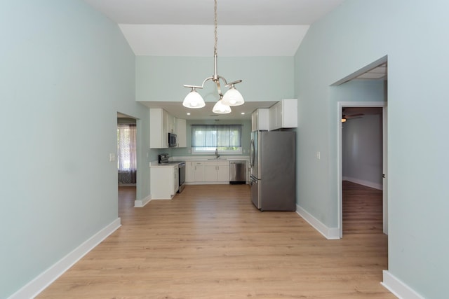 4836 Hillock Ave, North Charleston, SC 29418 - kitchen featuring appliances with stainless steel finishes, a chandelier, light countertops, white cabinetry, and light wood-type flooring