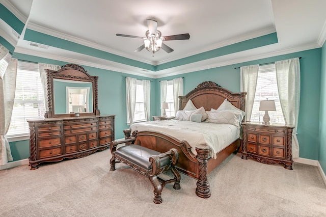 carpeted bedroom featuring multiple windows, crown molding, ceiling fan, and baseboards