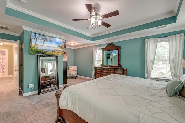 bedroom with light carpet, multiple windows, ornamental molding, baseboards, and ceiling fan