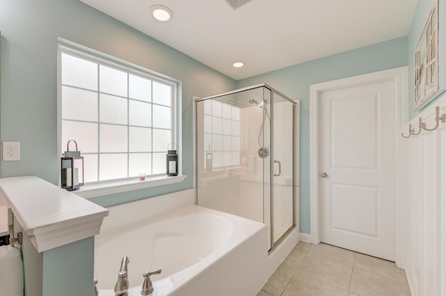 full bath with tile patterned floors, a shower stall, and a bath