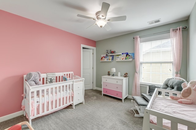 carpeted bedroom featuring baseboards and ceiling fan