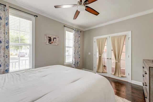 bedroom featuring dark wood finished floors, ornamental molding, a ceiling fan, and baseboards