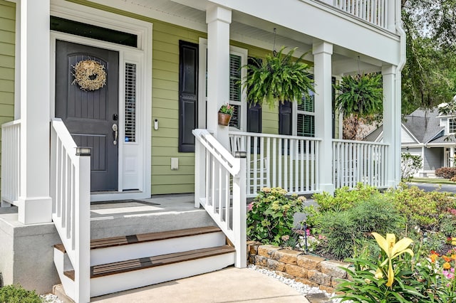entrance to property featuring a porch