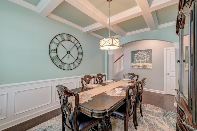 dining room featuring coffered ceiling, arched walkways, beamed ceiling, dark wood-style floors, and crown molding