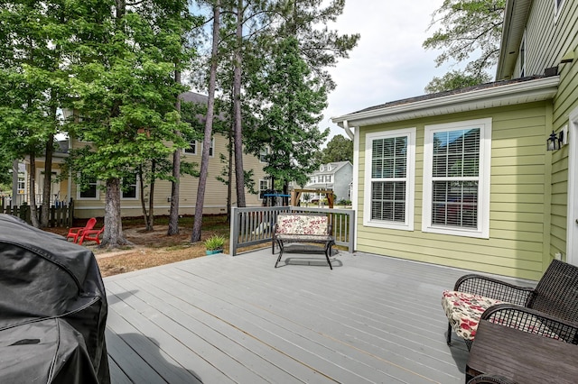 wooden deck with area for grilling