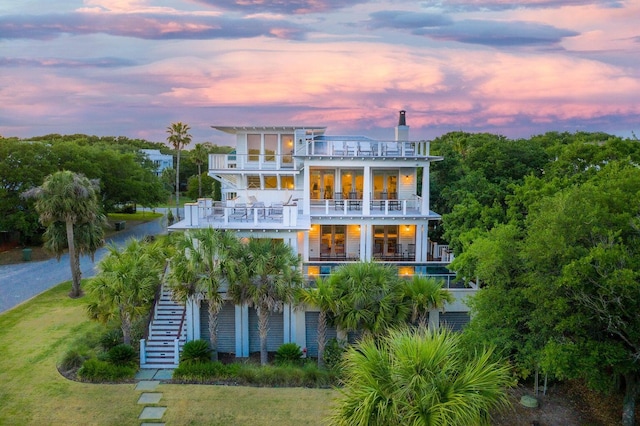 4001 Palm Blvd, Isle Of Palms, SC 29451 - rear view of property featuring a balcony, stairs, and an outdoor pool
