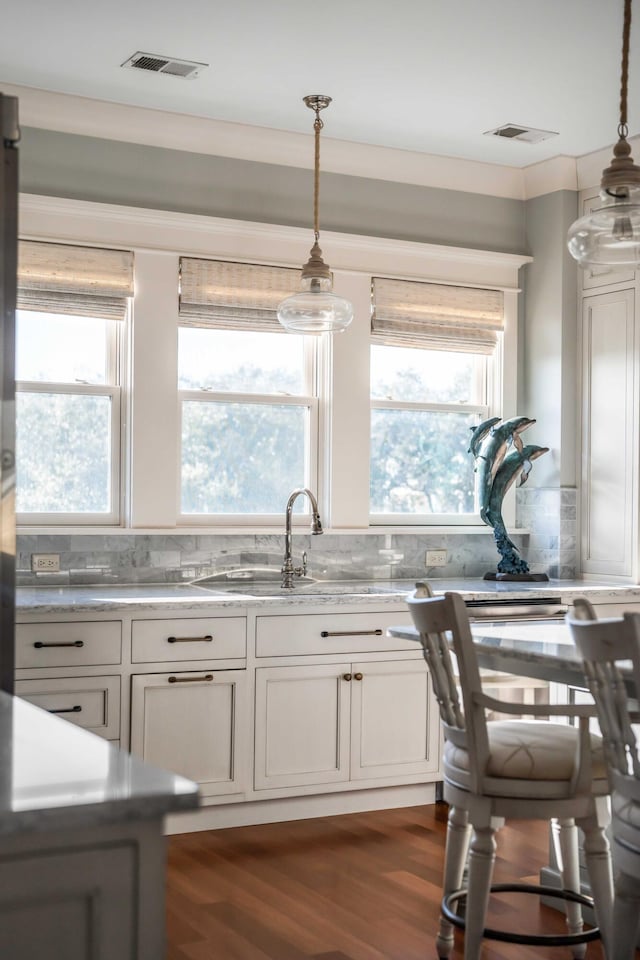 4001 Palm Blvd, Isle Of Palms, SC 29451 - kitchen with a sink, hanging light fixtures, white cabinetry, and dark wood-style flooring