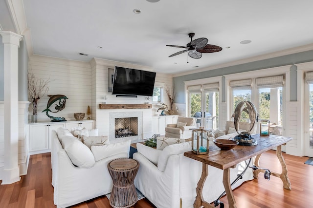 4001 Palm Blvd, Isle Of Palms, SC 29451 - living room with ceiling fan, wood finished floors, ornate columns, ornamental molding, and a fireplace