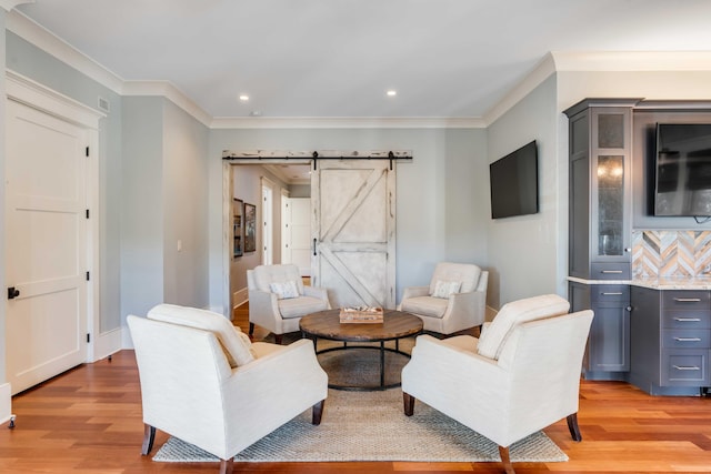 4001 Palm Blvd, Isle Of Palms, SC 29451 - living area featuring light wood-style floors, crown molding, a barn door, recessed lighting, and baseboards