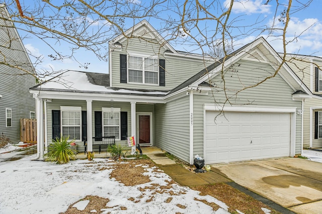 view of front of property with a garage and covered porch