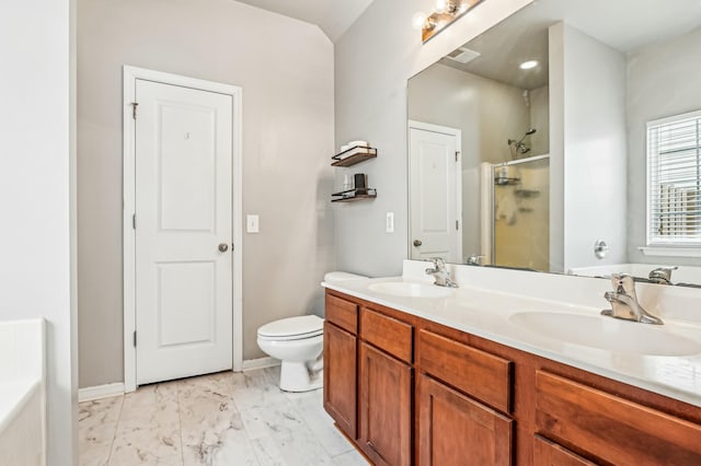 bathroom with vanity, toilet, and a shower with door