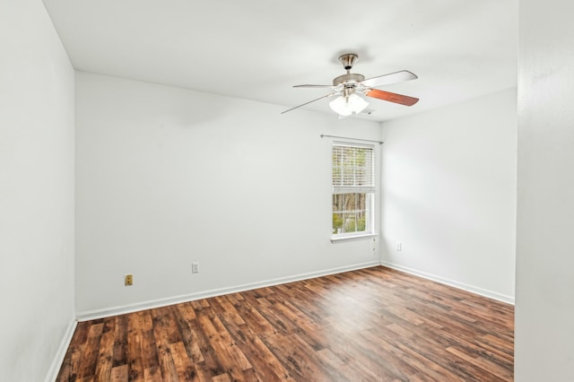 unfurnished room featuring dark wood-type flooring and ceiling fan