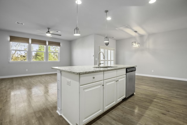 kitchen featuring white cabinets, dishwasher, decorative light fixtures, sink, and a kitchen island with sink